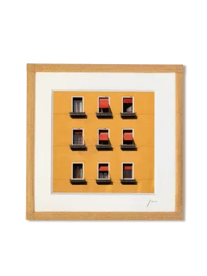 tirage photo petit format encadré à la main représentant une façade jaune et 9 fenêtres au store rouge