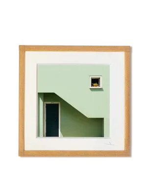 tirage photo petit format encadré à la main représentant une façade vert pâle